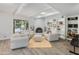 Bright Gathering room with fireplace, beamed ceiling, backyard access, and built-in shelves at 11051 N 45Th Pl, Phoenix, AZ 85028