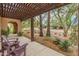 Covered patio area featuring lounge seating and desert landscaping at 11051 N 45Th Pl, Phoenix, AZ 85028
