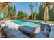 An inviting backyard oasis boasts a sparkling pool and a comfortable lounge area with plenty of seating at 11051 N 45Th Pl, Phoenix, AZ 85028