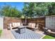 Backyard features seating, a fire pit, and an outdoor heater at 1140 E Vermont Dr, Gilbert, AZ 85295