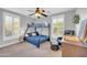 Bedroom featuring natural lighting, carpet flooring, ceiling fan and window shutters at 1140 E Vermont Dr, Gilbert, AZ 85295