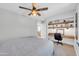 This bedroom boasts a built-in desk with floating shelves and neutral-colored walls at 1140 E Vermont Dr, Gilbert, AZ 85295