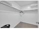 The walk-in closet features carpet floors, shelving on all walls, and hanging rods at 1140 E Vermont Dr, Gilbert, AZ 85295