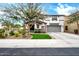 Charming two-story home with a well-maintained lawn, desert landscaping, and a two car garage at 1140 E Vermont Dr, Gilbert, AZ 85295
