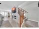 Open-concept living area featuring a fireplace, TV, and staircase with a view of the dining area at 1140 E Vermont Dr, Gilbert, AZ 85295