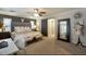 This is a bedroom with neutral walls and a gray tufted headboard at 1140 E Vermont Dr, Gilbert, AZ 85295