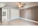 Stylish bedroom features modern ceiling fan, neutral paint, and ample closet space at 1147 E Belmont Ave, Phoenix, AZ 85020