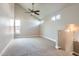 Bright bonus room featuring vaulted ceilings, contemporary ceiling fan and multiple windows at 1147 E Belmont Ave, Phoenix, AZ 85020
