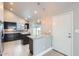 Bright kitchen featuring modern appliances, dark cabinets, and a convenient breakfast bar at 1147 E Belmont Ave, Phoenix, AZ 85020
