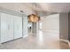 Spacious living room with hardwood floors, large windows, and modern lighting fixtures at 1147 E Belmont Ave, Phoenix, AZ 85020