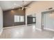 Inviting living room with a ceiling fan, hardwood floors, and a stylish accent wall at 1147 E Belmont Ave, Phoenix, AZ 85020