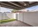 Covered patio featuring brick pavers, artificial turf and a view of neighboring properties at 1147 E Belmont Ave, Phoenix, AZ 85020