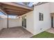 Covered patio with brick flooring, connecting indoor and outdoor living spaces at 1147 E Belmont Ave, Phoenix, AZ 85020