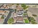 Aerial view of the home's backyard, solar panels and community at 11915 W Charter Oak Rd, El Mirage, AZ 85335