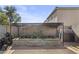 Backyard raised garden bed with awning provides a space for fresh herbs and vegetables at 11915 W Charter Oak Rd, El Mirage, AZ 85335