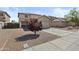 Two-story home with low maintenance desert landscaping and a two-car garage, offering curb appeal at 11915 W Charter Oak Rd, El Mirage, AZ 85335