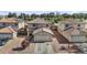 Two-story home featuring a tile roof, two-car garage, and desert landscaping for low maintenance at 11915 W Charter Oak Rd, El Mirage, AZ 85335