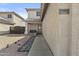Covered front porch with seating area, a desert-themed rock garden, and a secure screen door at 11915 W Charter Oak Rd, El Mirage, AZ 85335