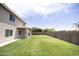 Large grassy backyard with block fence and covered patio is perfect for entertaining at 1374 N Alexis Dr, Gilbert, AZ 85234