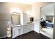 A bright bathroom boasting a marble countertop, double sink vanity, and view of the bedroom at 1374 N Alexis Dr, Gilbert, AZ 85234