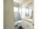 A full bathroom featuring a glass-enclosed shower, modern vanity, and a stylish neutral color palette at 1374 N Alexis Dr, Gilbert, AZ 85234