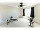 Spacious carpeted bedroom with ceiling fan, bright light, and room for exercise at 1374 N Alexis Dr, Gilbert, AZ 85234