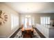 Bright dining room with a chandelier, table with seating for six, and natural lighting at 1374 N Alexis Dr, Gilbert, AZ 85234