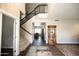 Bright foyer with hardwood floors, staircase, and elegant decor at 1374 N Alexis Dr, Gilbert, AZ 85234