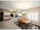Open kitchen with granite countertops, white cabinets, and modern appliances at 1374 N Alexis Dr, Gilbert, AZ 85234