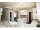 Modern kitchen featuring white cabinets, granite countertops, and stainless steel sink at 1374 N Alexis Dr, Gilbert, AZ 85234