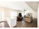 Spacious living room with hardwood floors, comfortable seating, and bright lighting at 1374 N Alexis Dr, Gilbert, AZ 85234