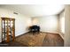 Comfortable living room featuring a piano, hardwood floors, and warm lighting at 1374 N Alexis Dr, Gilbert, AZ 85234
