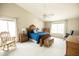 Spacious main bedroom with a vaulted ceiling, carpet, bright windows, and elegant wood furniture at 1374 N Alexis Dr, Gilbert, AZ 85234