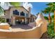 Home exterior featuring patio, outdoor fireplace, and desert landscaping at 15215 S 20Th Pl, Phoenix, AZ 85048