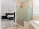 Contemporary bathroom with glass shower and adjacent bedroom area at 15215 S 20Th Pl, Phoenix, AZ 85048