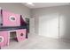 Bright bedroom featuring a custom-built bunk bed with gray walls and white trim at 15215 S 20Th Pl, Phoenix, AZ 85048