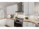 The kitchen boasts stainless steel appliances, granite countertops, and bright white cabinetry at 15215 S 20Th Pl, Phoenix, AZ 85048