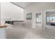 Bright loft featuring neutral walls, carpet floors, and a view of adjacent room at 15215 S 20Th Pl, Phoenix, AZ 85048