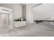 Spacious loft area with high ceilings, a built-in cabinet and black railing at 15215 S 20Th Pl, Phoenix, AZ 85048