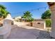 Patio with outdoor fireplace, barbecue, concrete pavers and string lights at 15215 S 20Th Pl, Phoenix, AZ 85048