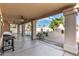 Covered patio overlooking backyard with outdoor kitchen, fireplace and pool at 15215 S 20Th Pl, Phoenix, AZ 85048