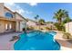Beautiful backyard featuring a lagoon-style pool with desert landscaping and sunny skies at 15215 S 20Th Pl, Phoenix, AZ 85048