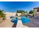 Backyard pool featuring diving board, surrounding patio, and desert landscaping at 15215 S 20Th Pl, Phoenix, AZ 85048