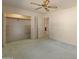 Bedroom featuring a ceiling fan and a walk-in closet at 15610 N 98Th Ave # 26, Sun City, AZ 85351