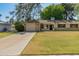 Charming single-story home featuring a well-maintained lawn, complemented by mature trees at 15610 N 98Th Ave # 26, Sun City, AZ 85351