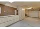 Spacious garage with cabinets, storage and utility connections at 15610 N 98Th Ave # 26, Sun City, AZ 85351