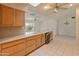 Functional kitchen featuring a skylight, ample counter space, and a convenient dishwasher at 15610 N 98Th Ave # 26, Sun City, AZ 85351