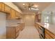 Well-lit kitchen with functional layout, featuring ample cabinets, counter space, and modern appliances at 15610 N 98Th Ave # 26, Sun City, AZ 85351