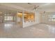 Open-concept living area with tile flooring, multiple windows, and seamless flow into the kitchen at 15610 N 98Th Ave # 26, Sun City, AZ 85351