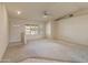 Bright living room with carpet flooring, complemented by large windows at 15610 N 98Th Ave # 26, Sun City, AZ 85351